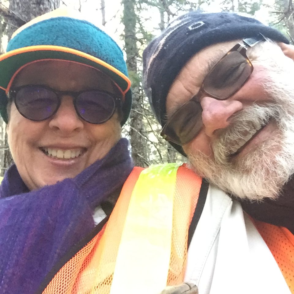 Marian and Bruce in a selfie smiling. Bundled up for a winter picnic.